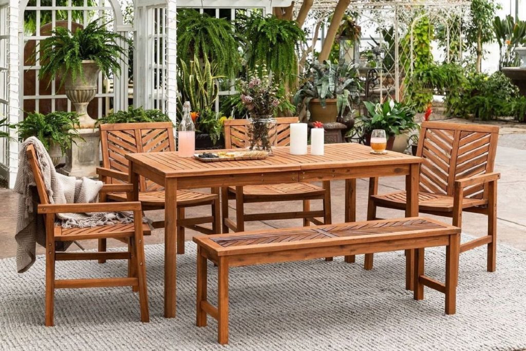large wooden outdoor dining table with wooden chairs