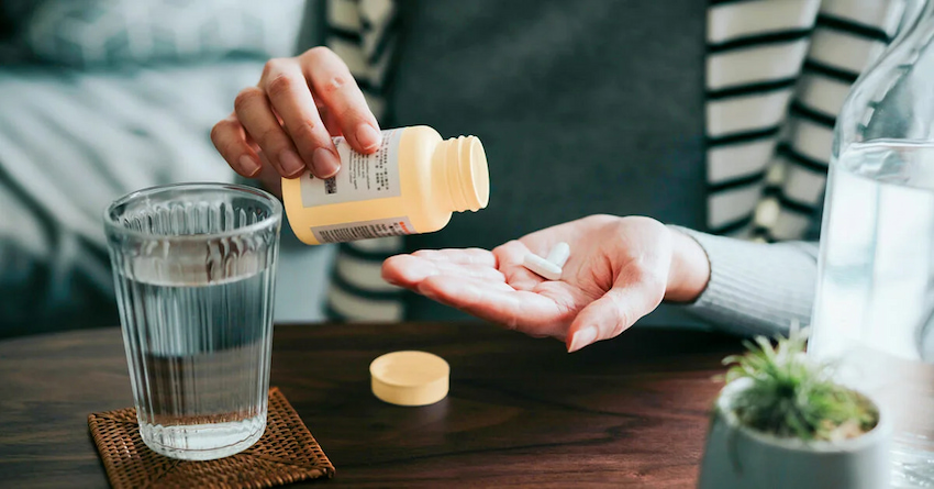 zinc supplements in woman hand