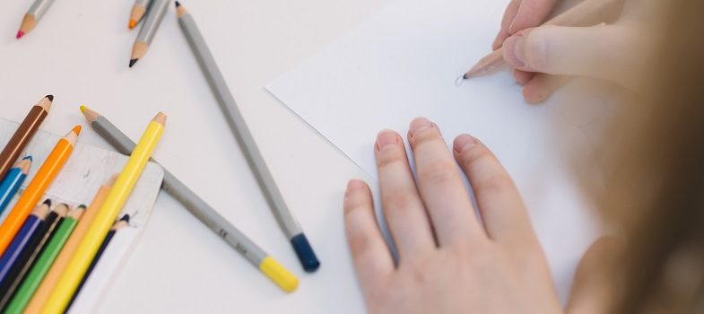 woman using colour pencils for drawing
